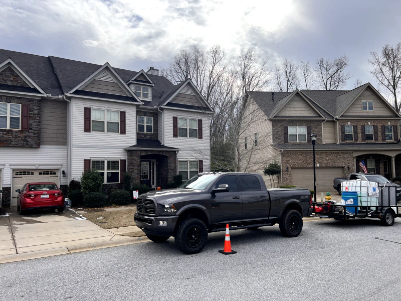 black truck in front of homes in nice neighborhood